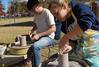 Art majors Phillip Baker and Lori Landon created and sold pottery on the Great Lawn during Arts in the Park. - Photo by Abigail Harris