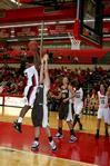 11/310/10 - Lavanda Ross jumps over her University of St. Francis opponents for a shot in the homecoming game. The Lady Bulldogs won the game 83-57. 