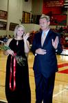 Stephanie Sowell, senior elementary education major, waves to the crowd as she is escorted in the homecoming court.  - Photo by Deanna Santangelo