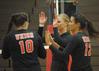 10/301/10 - �鶹��Ƶ players celebrate after a point. Shelby Swink (10), Emmie Moroski (middle), Marcela Madeira (12).