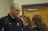 Ariel Apolonario, assistant volleyball coach, encourages the players during the game. - Photo by Morris Abernathy