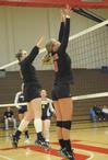 10/301/10 - Shelby Swink and Emmie Mososki go up for a block.