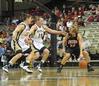 11/313/10 - Kayla Hudson dribbles around 2 Vanderbilt players in the exhibition game in Nashville. 