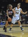 11/313/10 - Kayla Hudson dribbles the ball around Vanderbilt's Rebecca Silinski during an exhibition game held at Vandy. 