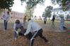 Students do yard work at the Care Center in Jackson, TN, during Campus and Community Day.  - Photo by Morris Abernathy