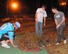 Seth Kincaid, junior mathmatics major, Patrick Jones, junior, and Josh Shell, sophomore Christian studies major, get ready to make their second putt during the Residence Life event, Puttapalooza. - Photo by Victoria Stargel