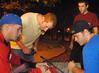 Jesper Swedenborg, Jeffrey Edwards, Casey Kidd, and Michael Forsythe check their putt-putt score at the Men's Residence Life event, Puttapalooza. - Photo by Victoria Stargel