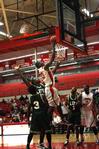 11/16/10 - Samuel Danache goes up for a shot under the goal while Life University defensive players guard him.

