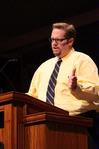 Hunter Baker, associate professor of political science, addresses the student body and visiting students during the preview day chapel.  - Photo by Ebbie Davis
