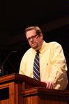 Hunter Baker, associate professor of political science, speaks during chapel.  - Photo by Ebbie Davis