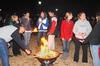 Heritage Complex residents gather around a fire pit to toast their marshmallows during S'more Giving. S'more Giving is a competition between residence complex buildings to raise the most change to provide Thanksgiving meals to needy families in the Jackson community. - Photo by Victoria Stargel