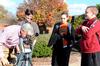 Bill Nettles, professor of physics and department chair, looks at sunspots through a solar telescope as his students Ben Haws, Allison Hearn, and Kendall Lewis observe. - Photo by Victoria Stargel