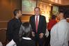 Dr. Keith Absher, dean of the McAfee school of business administration, visits with students and friends before the Black History Month program. - Photo by Morris Abernathy