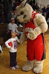 Buster the Bulldog chats with a young basketball fan at the Lady Bulldogs' game against Bethel University.  - Photo by Ebbie Davis