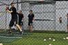 The baseball team practices their hitting in the Fesmire Field House.  - Photo by Victoria Stargel