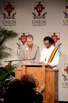 Zachary Pendergrass, coordinator of career planning and development, reads a Bible verse in English as Mikias Seid, senior intercultural studies and computer science major, reads the same verse in Amharic at the Fourth Annual Black History Month Program. - Photo by Deanna Santangelo