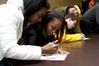 Nar'asha Randall, freshman biology major, and Janay Draper, freshman nursing major, answer a quiz during the first round of events during the Amazing Race for January term students presented by Residence Life. - Photo by Deanna Santangelo