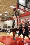02/3/11 - Roland Banhoro, senior center, goes up for a basket against Bethel University defenders. The Bulldogs won the game 77-75. 