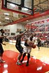 02/3/11 - Shane Burrell goes up for a shot against Bethel University defenders. The Bulldogs won the game 77-75.