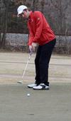 02/54/11 - Micah Gentle practices putting at the Jackson National Golf Course.