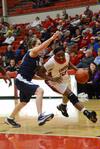 02/52/11 - Lady bulldog Lavanda Ross pushes past her Lyon College opponent as she goes for a lay-up. The Lady Bulldogs won the game 65-44.