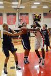 Hope Adams fights for the rebound against her Lyon College opponents.  - Photo by Beth Spain