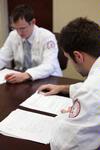 Pharmacy students review their patient notes during class.  - Photo by Kristi McMurry