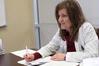 Kimberly Lindsey, assistant professor of pharmacy practice, takes notes on student presentations during class.  - Photo by Kristi McMurry