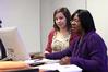 Rhonda Hudson, associate professor of social work and director of BSW adult studies program, helps Rachael Collins, junior social work major, get her presentation for class started.  - Photo by Kristi McMurry