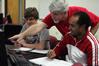 Bill Nettles, professor of physics and department chair, helps students with their work in the new physics lab. - Photo by Kristi McMurry