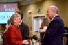 Lanese Dockery, first lady of the university, greets speaker Scott Rasmussen, founder and president of Rasmussen Reports, during Union Forum in the Carl Grant Event Center. - Photo by Deanna Santangelo