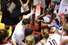 Mark Campbell, head coach, talks to the Lady Bulldogs during a timeout in the first game of the NAIA National Championship.  - Photo by Abigail Harris