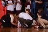 03/77/11 - Mark Campbell, head coach, and others check on LaTesa McLaughlin after an injury in game two of the NAIA National Championship. 