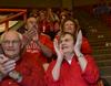 Max and Ann Walker (bottom), along with Bill and Brenda Welch above them, cheer the lady bulldogs to victory. Ann, who has attended the NAIA championship games for 22 years, said she was "sorry this is the last year" the NAIA would be in Jackson. - Photo by Beth Spain