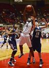 Hope Adams battles for a rebound in the semifinals game against Shawnee State University. - Photo by Beth Spain