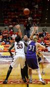 03/77/11 - Zeinab Chan jumps for the toss-up. �鶹��Ƶ Lady Bulldogs play Olivet Nazarene in the second round of the 2011 NAIA Division I Women's Basketball National Championship. �鶹��Ƶ won 81 to 69. 