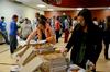 Students get their pizza during the March Madness event hosted by residence life in the Bowld Student Commons.  - Photo by Ebbie Davis