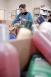 11/10/03 - Sophomore Laura Berkemeyer, art major, sorts through boxes of donations at the Red Cross during the Day of Remembrance.