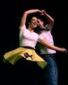 Rob Calvert, junior engineering major, twirls his partner, Amanda Holloway, junior nursing major, as they perform for the "There and Back Again" group at the 14th annual Variety Show. - Photo by Ebbie Davis