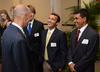 Tony Dungy, Super Bowl winning coach, greets Luke Foshee, junior biology major, at the meet and greet part of the Roy L. White Golf and Gala.  - Photo by Ebbie Davis