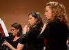 Hannah Crossett (left), junior psychology major, Rachel Robbins, freshman music major, and Emily Hughes, sophomore nursing major, play as the Union University Symphonic Band gives their Spring Concert in the Savage Memorial Chapel.  - Photo by Victoria Stargel