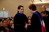 Fonsie Guilaran, associate professor of physics, receives the Howard Newell Innovative Teaching Award from Howard Newell, professor of business administration, during Awards Day chapel. - Photo by Deanna Santangelo