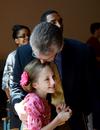 Robert Graves, vice president for undergraduate admissions and the recipient of the Staff Member of the Year Award, hugs his daughter during Awards Day chapel. - Photo by Deanna Santangelo