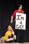 Brennan Uthe imitates a Union speed bump by attaching to Jodie Curtis as a car at the SAC Variety Show during Family Weekend 2003. - Photo by Lindsay Stavish