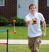 Zachary Key, junior medical technology major, participates in May Day games outside the Bowld Student Commons. - Photo by Zac Calvert