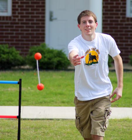 Zachary Key, junior medical technology major, participates in May Day games outside the Bowld Student Commons.