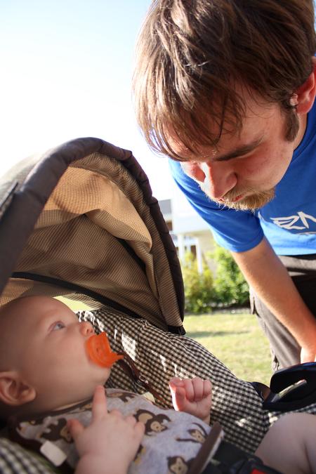 Beau Fant, freshman political science major, makes a funny face at Titus Jackson, son of Residence Director Ashley Jackson, during May Day, an event hosted by SAC.