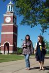 Shinae Giffin and Katherine Crutcher, junior art majors, walk across campus after their class in Jennings Hall.   - Photo by Kristi McMurry