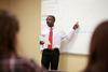 Richard Addo, associate professor of pharmacy, reviews his students for the final exam.  - Photo by Kristi McMurry