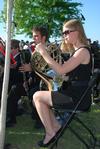 Rebecca Henderson, sophomore music education major, performs during spring graduation on the Great Lawn. - Photo by Jacob Moore